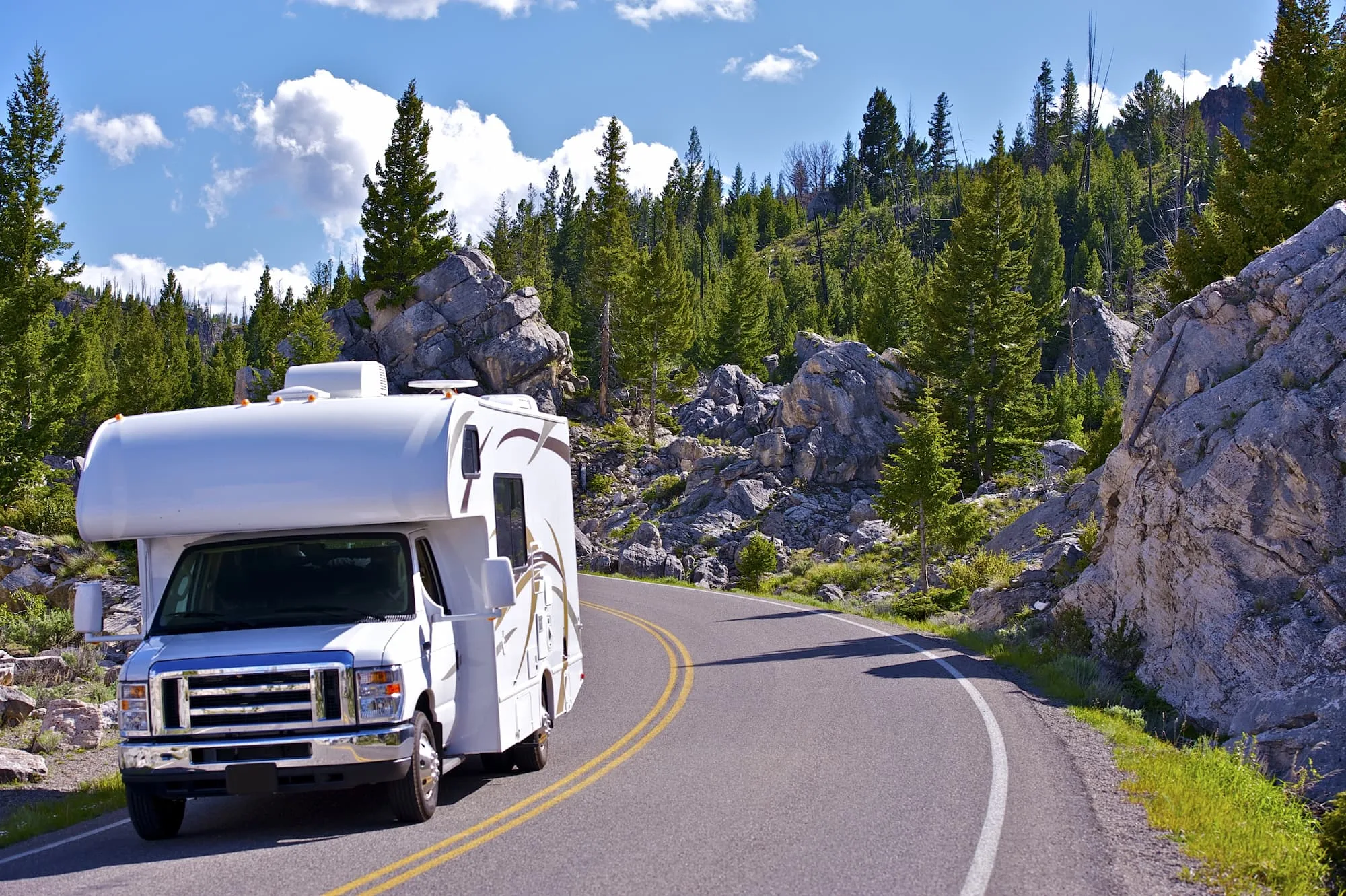 RV on road trip in the mountains